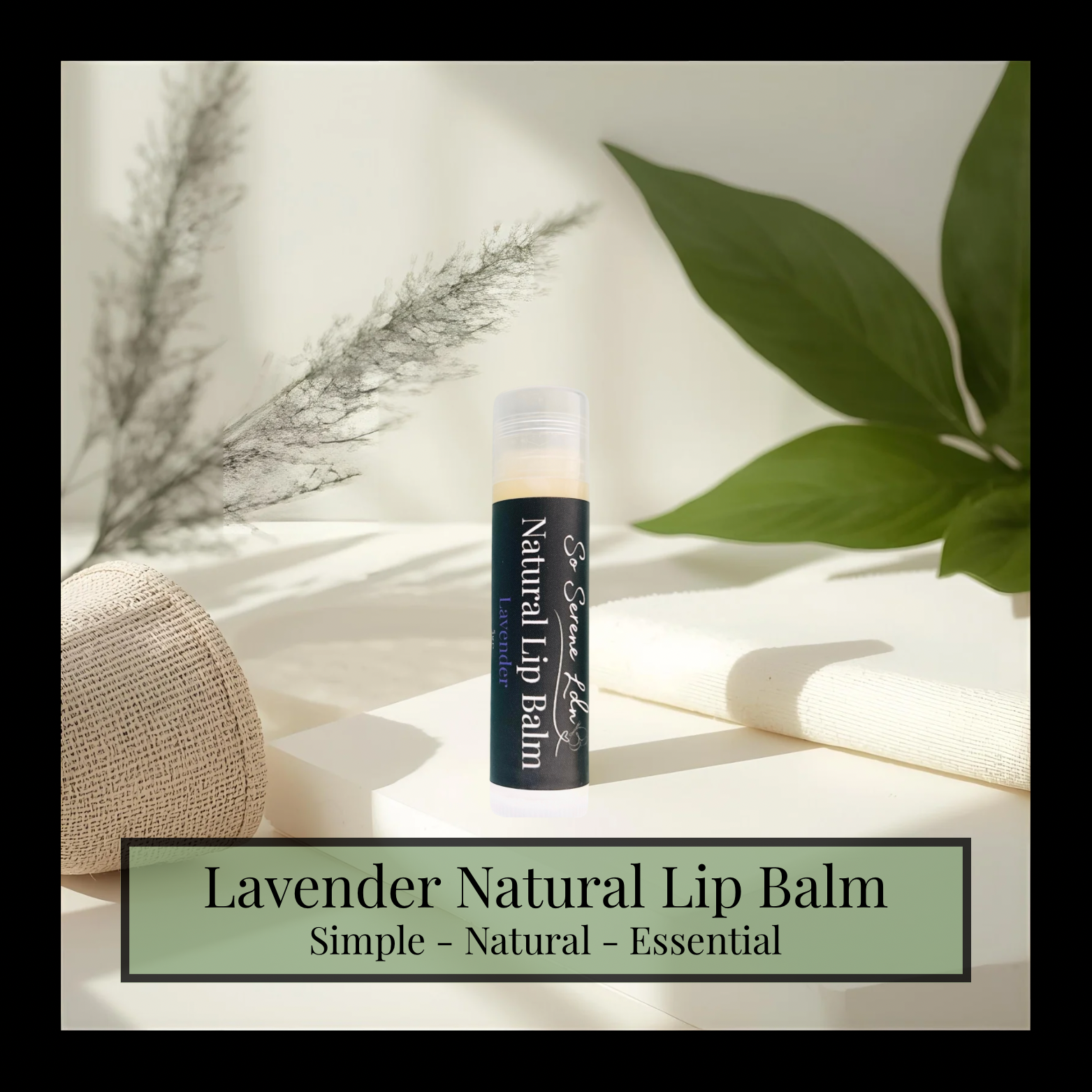 Lavender natural lip balm on a light surface with green leaves and a woven object in the background.